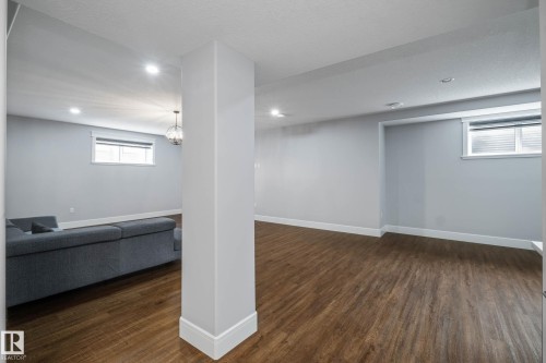 Basement featuring dark wood-type flooring and recessed lighting - 4086 Whispering River Drive, Edmonton, AB - Indoor