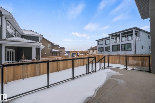 Fenced backyard featuring a residential view and a patio - 4086 Whispering River Drive, Edmonton, AB - Outdoor With Exterior