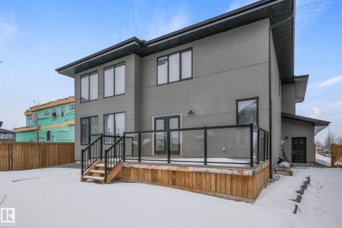 Snow covered back of property with stucco siding - 4086 Whispering River Drive, Edmonton, AB - Outdoor With Exterior