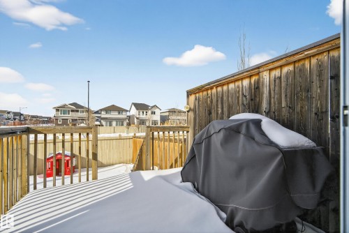 Deck featuring a residential view and a fenced backyard - 2704 Coughlan Green, Edmonton, AB - Outdoor With Exterior
