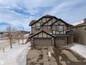 Tudor-style house with roof with shingles, driveway, and a garage - 2704 Coughlan Green, Edmonton, AB  - Outdoor 