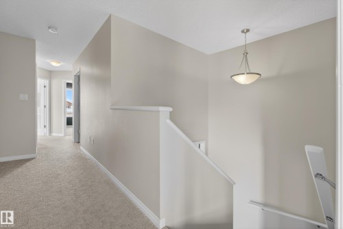 Corridor with an upstairs landing and carpet flooring - 2704 Coughlan Green, Edmonton, AB - Indoor Photo Showing Other Room