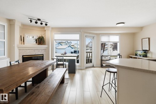 38 882 Ryan Place, Edmonton, AB - Indoor Photo Showing Dining Room With Fireplace