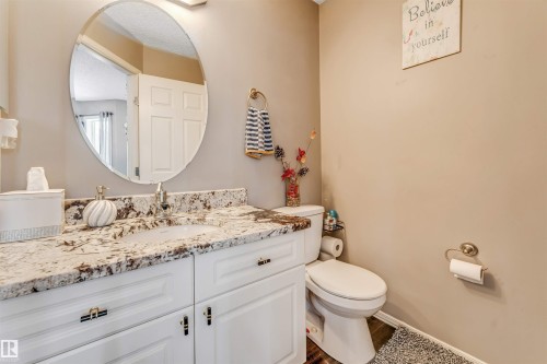 Half bathroom with vanity and toilet - 4404 150 Avenue, Edmonton, AB - Indoor Photo Showing Bathroom