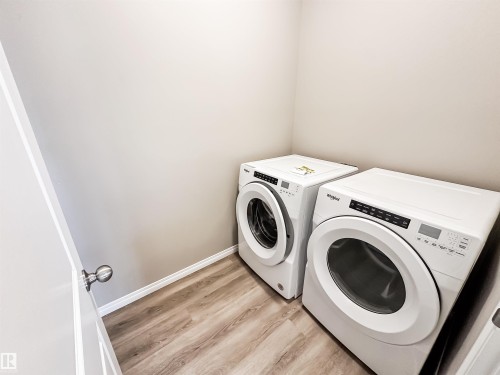 100 2072 Wonnacott Way, Edmonton, AB - Indoor Photo Showing Laundry Room