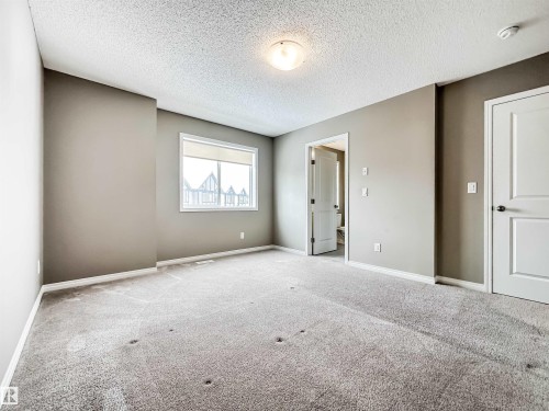100 2072 Wonnacott Way, Edmonton, AB - Indoor Photo Showing Other Room