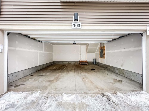 100 2072 Wonnacott Way, Edmonton, AB - Indoor Photo Showing Garage