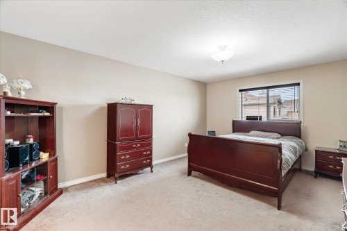 Bedroom with baseboards and light colored carpet - 66 Nadine Way, St. Albert, AB - Indoor Photo Showing Bedroom