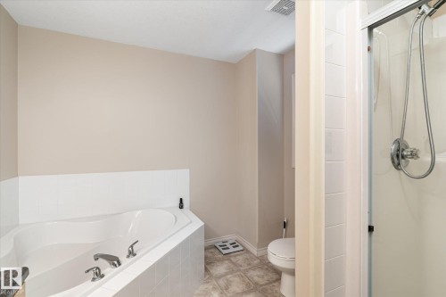 Full bath featuring a stall shower and a garden tub - 66 Nadine Way, St. Albert, AB - Indoor Photo Showing Bathroom