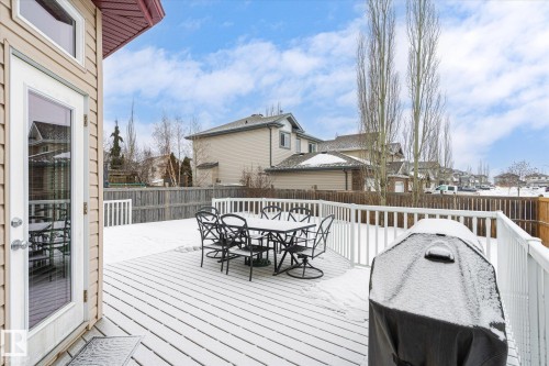 Deck with outdoor dining space, a residential view, and a fenced backyard - 66 Nadine Way, St. Albert, AB - Outdoor With Deck Patio Veranda With Exterior
