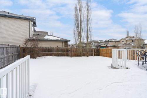 Fenced backyard featuring a residential view and a wooden deck - 66 Nadine Way, St. Albert, AB - Outdoor With Exterior