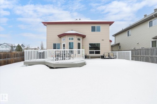 Snow covered property featuring a deck and a fenced backyard - 66 Nadine Way, St. Albert, AB - Outdoor With Deck Patio Veranda With Exterior