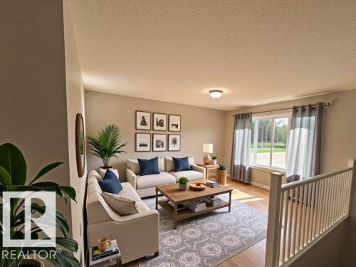 Living area featuring a textured ceiling and light wood-style floors - 130 1 Street, Blue Ridge, AB - Indoor Photo Showing Living Room