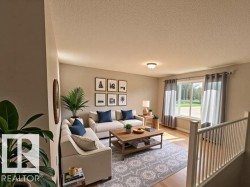 Living area featuring a textured ceiling and light wood-style floors - 