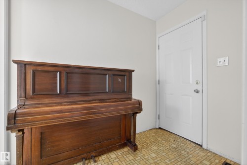 Entrance foyer featuring brick patterned flooring - 11435 37A Avenue, Edmonton, AB - Indoor Photo Showing Other Room