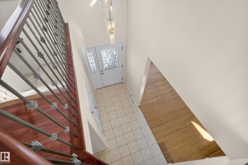 Entrance foyer with light tile patterned floors, hanging lights, and a high ceiling - 11435 37A Avenue, Edmonton, AB - Indoor Photo Showing Other Room