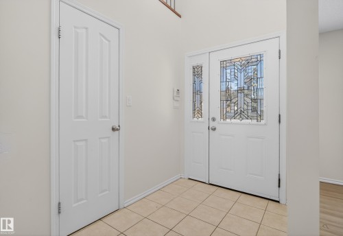 Foyer entrance featuring light tile patterned floors - 11435 37A Avenue, Edmonton, AB - Indoor Photo Showing Other Room
