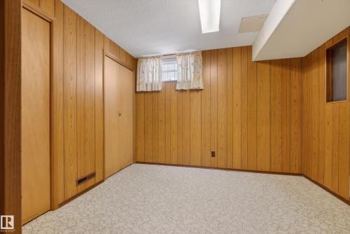 Basement with a textured ceiling and carpet - 11435 37A Avenue, Edmonton, AB - Indoor Photo Showing Other Room
