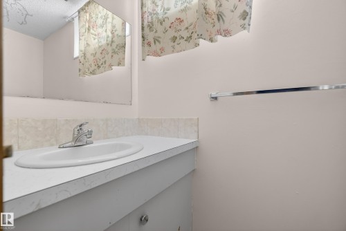 Half bath with vanity - 11435 37A Avenue, Edmonton, AB - Indoor Photo Showing Bathroom