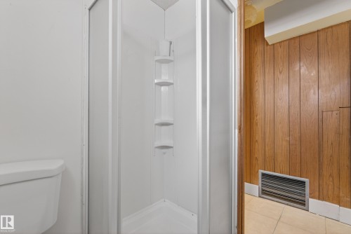 Bathroom featuring a stall shower and light tile patterned flooring - 11435 37A Avenue, Edmonton, AB - Indoor Photo Showing Other Room