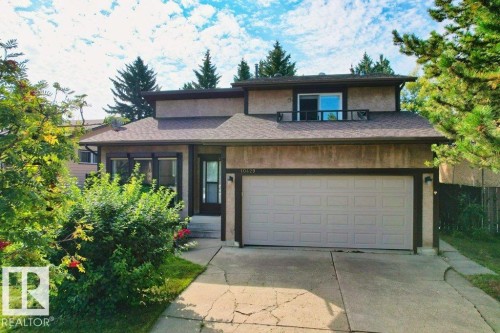 Prairie-style house featuring driveway, stucco siding, and roof with shingles - 10429 28A Avenue, Edmonton, AB - Outdoor