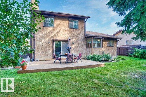 Back of house with stucco siding and a wooden deck - 10429 28A Avenue, Edmonton, AB - Outdoor