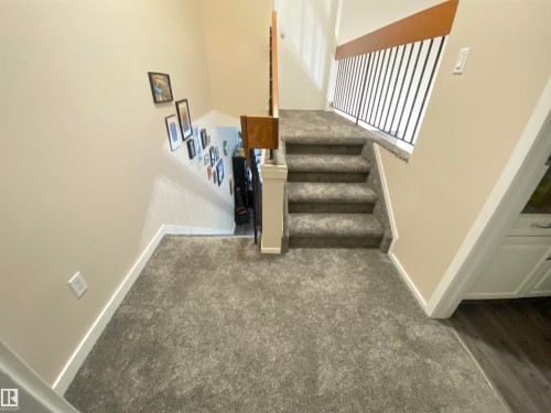 Staircase featuring carpet floors and baseboards - 11176 83 Avenue, Edmonton, AB - Indoor Photo Showing Other Room