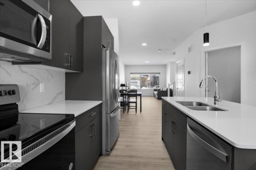3323 Erlanger Bend, Edmonton, AB - Indoor Photo Showing Kitchen With Stainless Steel Kitchen With Double Sink With Upgraded Kitchen
