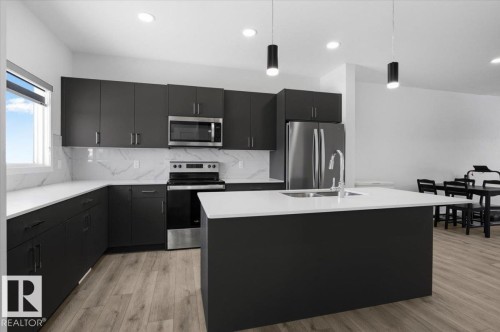 3323 Erlanger Bend, Edmonton, AB - Indoor Photo Showing Kitchen With Stainless Steel Kitchen With Double Sink With Upgraded Kitchen