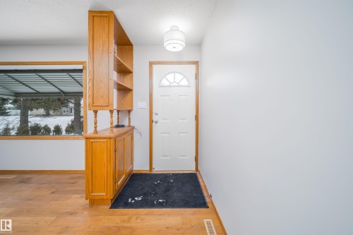 Doorway to outside featuring wood finished floors and baseboards - 8908 130 Avenue Nw, Edmonton, AB - Indoor Photo Showing Other Room