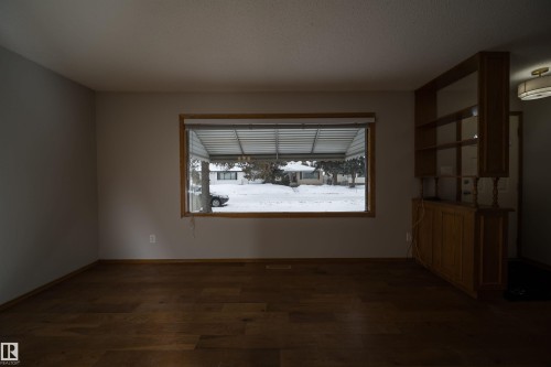 Spare room with dark wood finished floors and baseboards - 8908 130 Avenue Nw, Edmonton, AB - Indoor Photo Showing Other Room