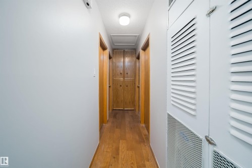 Hall with attic access and hardwood / wood-style floors - 8908 130 Avenue Nw, Edmonton, AB - Indoor Photo Showing Other Room