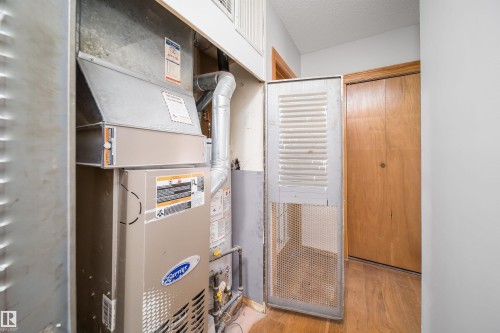 Utilities featuring heating unit - 8908 130 Avenue Nw, Edmonton, AB - Indoor Photo Showing Basement