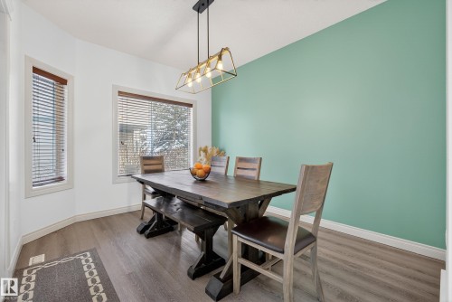 Dining space featuring wood finished floors - 44 903 Rutherford Road, Edmonton, AB - Indoor Photo Showing Dining Room