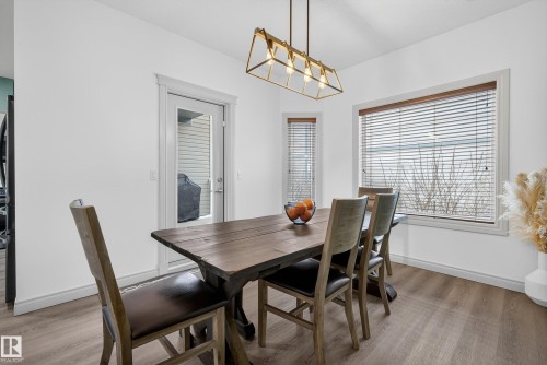 Dining area with baseboards and light wood finished floors - 44 903 Rutherford Road, Edmonton, AB - Indoor Photo Showing Dining Room