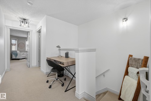 Office area featuring a textured ceiling and light carpet - 44 903 Rutherford Road, Edmonton, AB - Indoor