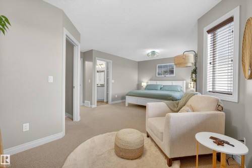 Bedroom with light carpet and baseboards - 44 903 Rutherford Road, Edmonton, AB - Indoor