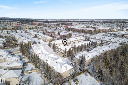 Snowy aerial view featuring a view of city - 44 903 Rutherford Road, Edmonton, AB - Outdoor With View