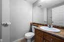 Half bathroom with vanity and a textured ceiling - 5 130 Hyndman Crescent, Edmonton, AB  - Indoor Photo Showing Bathroom 