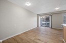 Unfurnished room with a textured ceiling and light wood-style floors - 5 130 Hyndman Crescent, Edmonton, AB  - Indoor Photo Showing Other Room 