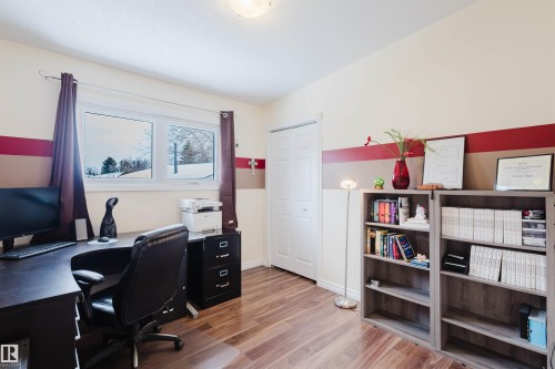 Office space with light wood-style flooring and baseboards - 11519 37A Avenue, Edmonton, AB - Indoor Photo Showing Office