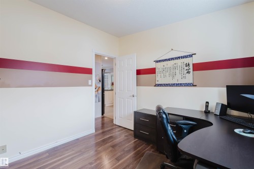 Office space with dark wood-style floors and baseboards - 11519 37A Avenue, Edmonton, AB - Indoor Photo Showing Office