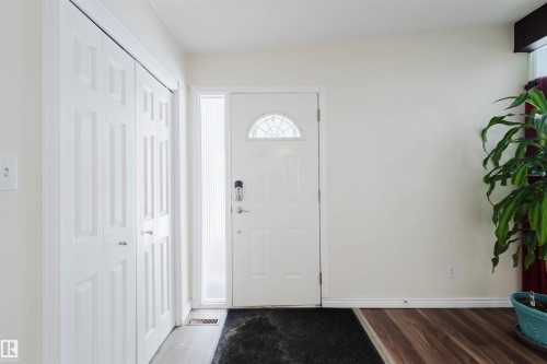Foyer featuring healthy amount of natural light and wood finished floors - 11519 37A Avenue, Edmonton, AB - Indoor Photo Showing Other Room