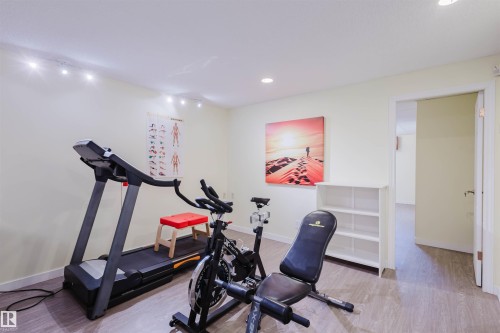 Exercise area with light wood-style flooring and recessed lighting - 11519 37A Avenue, Edmonton, AB - Indoor Photo Showing Gym Room