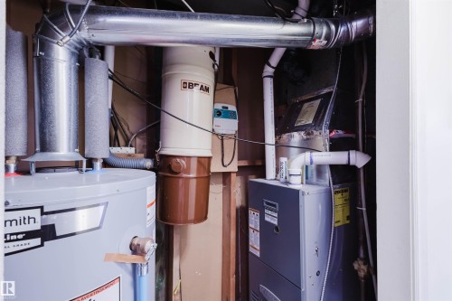 Utilities featuring heating unit and water heater - 11519 37A Avenue, Edmonton, AB - Indoor Photo Showing Basement