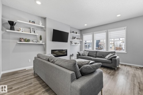 17475 77 Street, Edmonton, AB - Indoor Photo Showing Living Room With Fireplace
