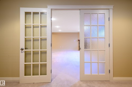 Hallway featuring light carpet - 48 Fairway Point(E), Spruce Grove, AB - Indoor Photo Showing Other Room