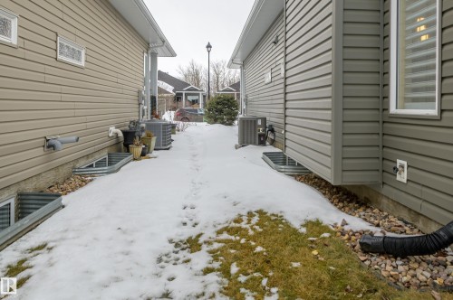 View of yard - 48 Fairway Point(E), Spruce Grove, AB - Outdoor With Exterior