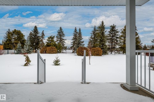 View of yard layered in snow - 48 Fairway Point(E), Spruce Grove, AB - Outdoor With View