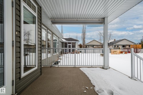 View of snow covered patio - 48 Fairway Point(E), Spruce Grove, AB - Outdoor With Exterior
